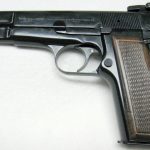 A side view of the FN Browning Hi Powered Standard before cleaning it
